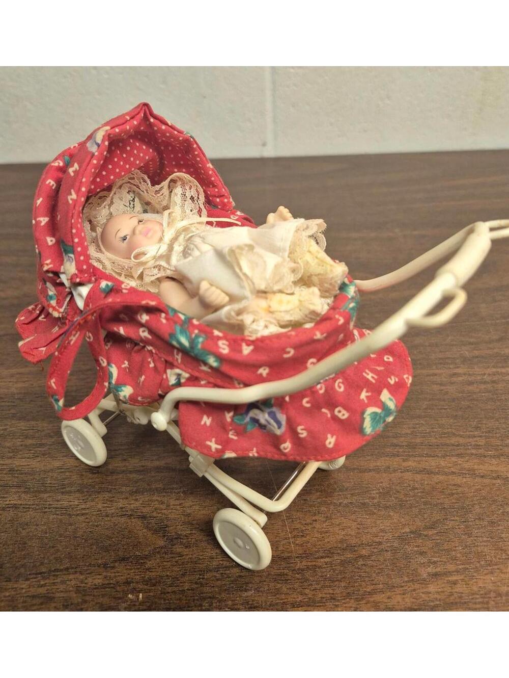 Vintage Baby Doll with Red Fabric Pram